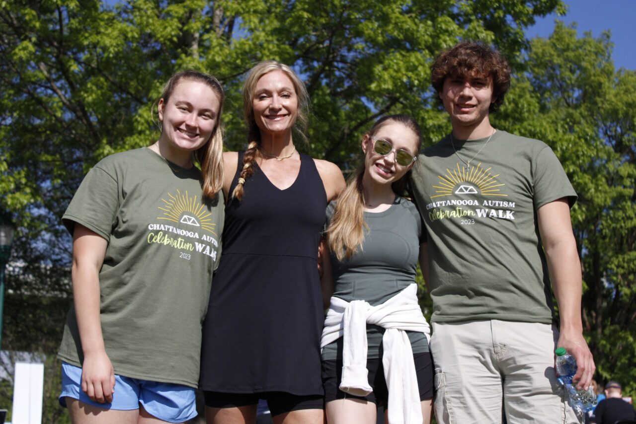 UTC freshman Ella Dunkelberger, left, attends the Chattanooga Autism Celebration Walk with her mom, Becky, her sister, Isabelle, and her sister’s boyfriend, Philip Forester, on Saturday, April 15. Photo by Bethany Cothran.
