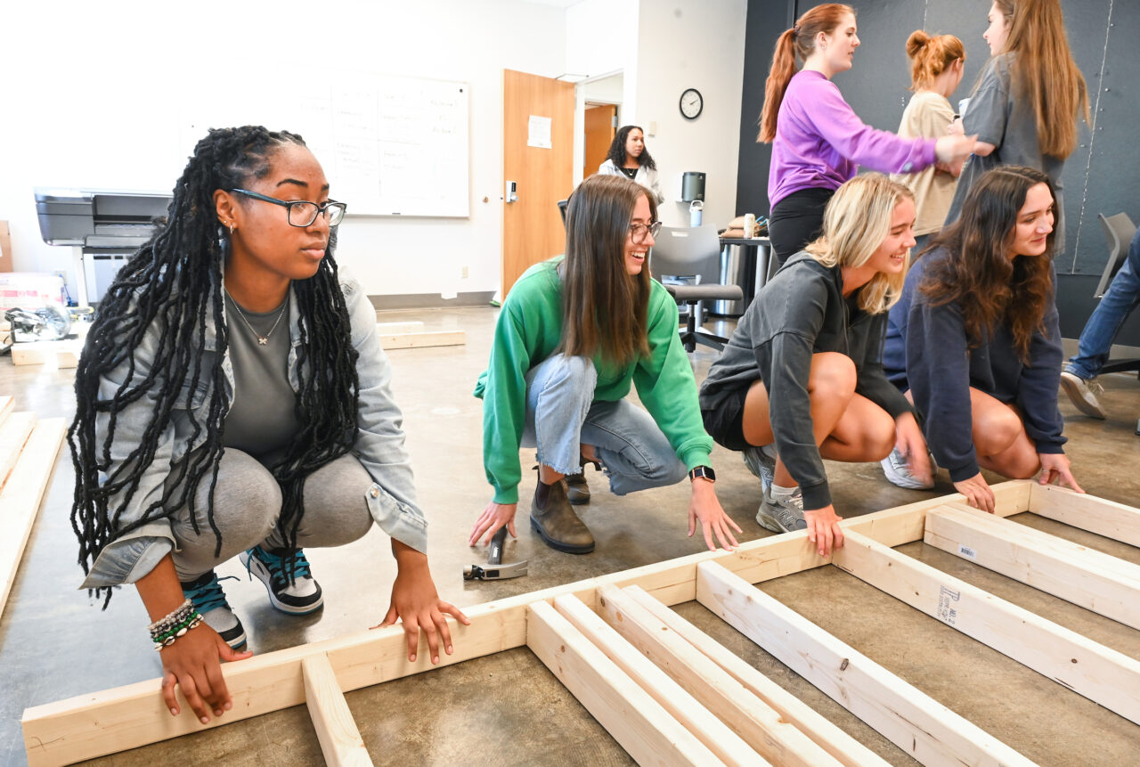 Students work on the wall build portion of Dr. Eun Young Kim’s Interior Systems Design class in Davenport Hall. Photo by Angela Foster.