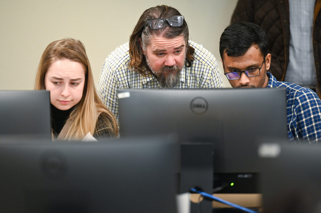 Steve Davenport, center, has taught an Introduction to Tax Preparation class this semester. Photo by Angela Foster.