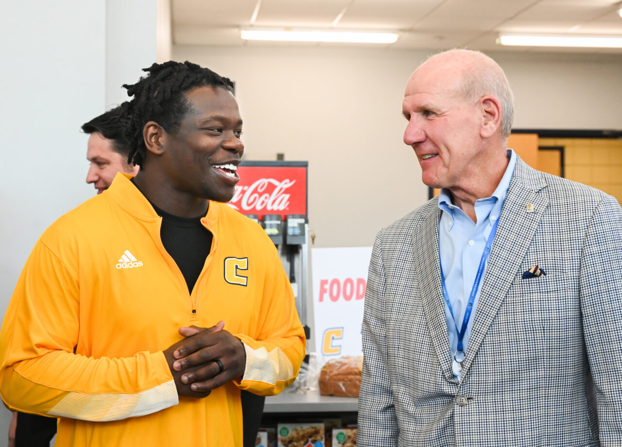 Steve Smith, Food City president and chief executive officer, right, talks with football player Ailym Ford, left, during an event Thursday, May 25 in the Brenda Lawson Student-Athlete Success Center to announce that Food City will be funding a Fueling Station featuring healthy food options for athletes.