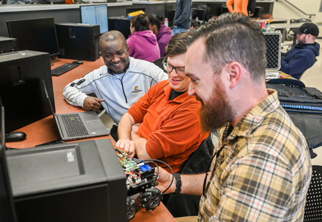 Students work with robots in Dr. Abdul Ofoli’s Fuzzy Logic and Intelligent Controls Application class in the Engineering and Computer Science building. Photo by Angela Foster.