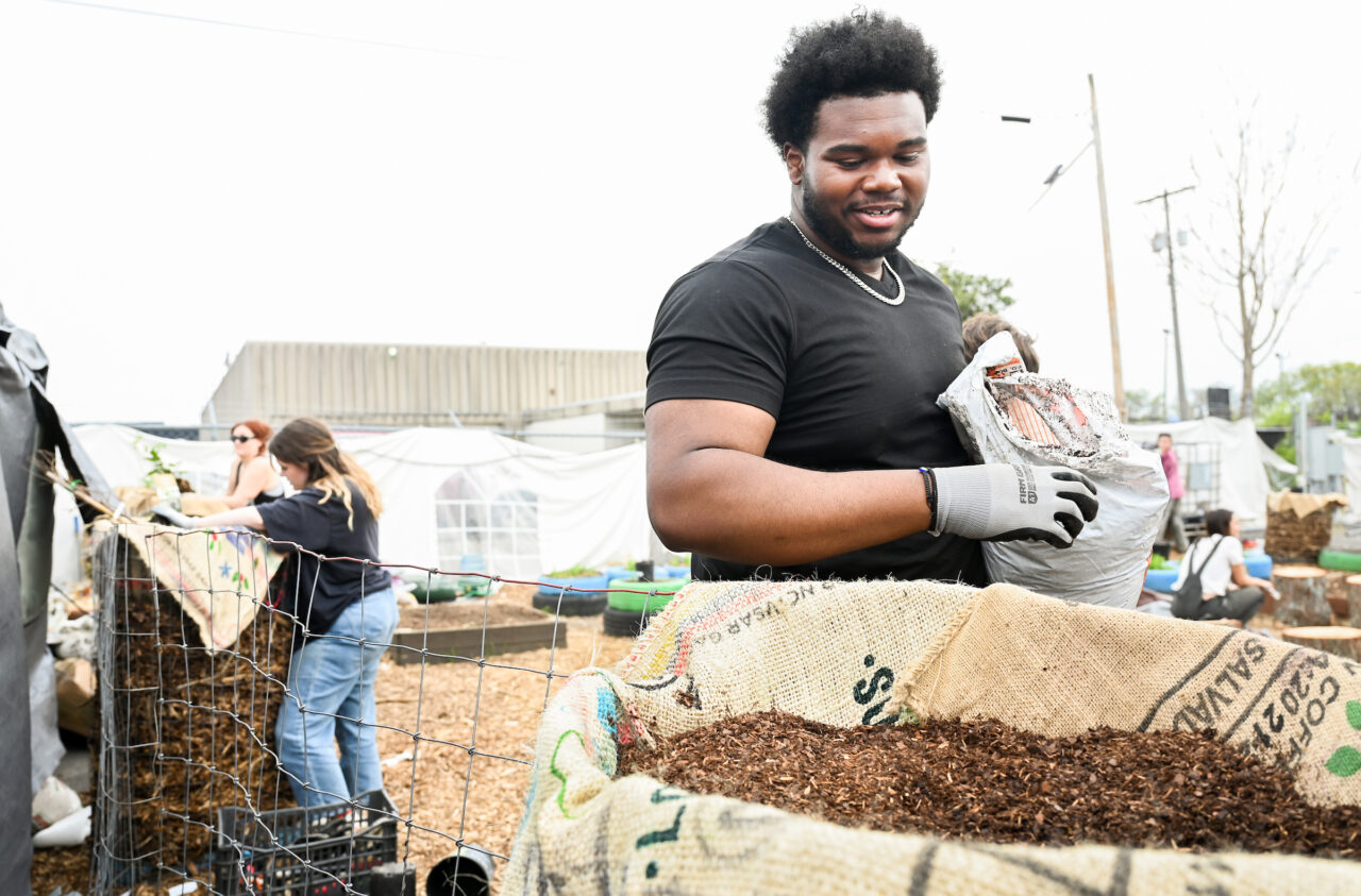 Christina Gibson and students work on a garden as part of her Regenerative Design Principles, Processes, and Methods class on Wednesday, Mar. 8, 2023. She and Lucy Schultz were awarded a $2000 grant from the Walker Center for “Creating a Sustainable Food Forest at the 12th and Peeples Street Camp.”