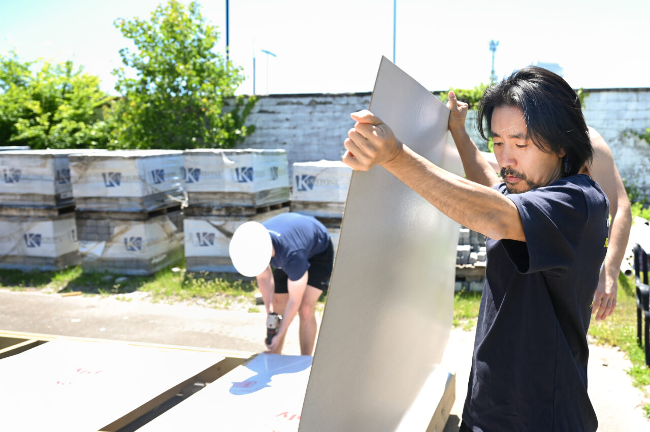 Members of the Solar Decathlon team work Wednesday, May 3, 2023 at Engel Stadium.