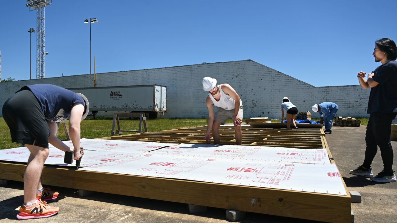 Members of the Solar Decathlon team work Wednesday, May 3, 2023 at Engel Stadium.
