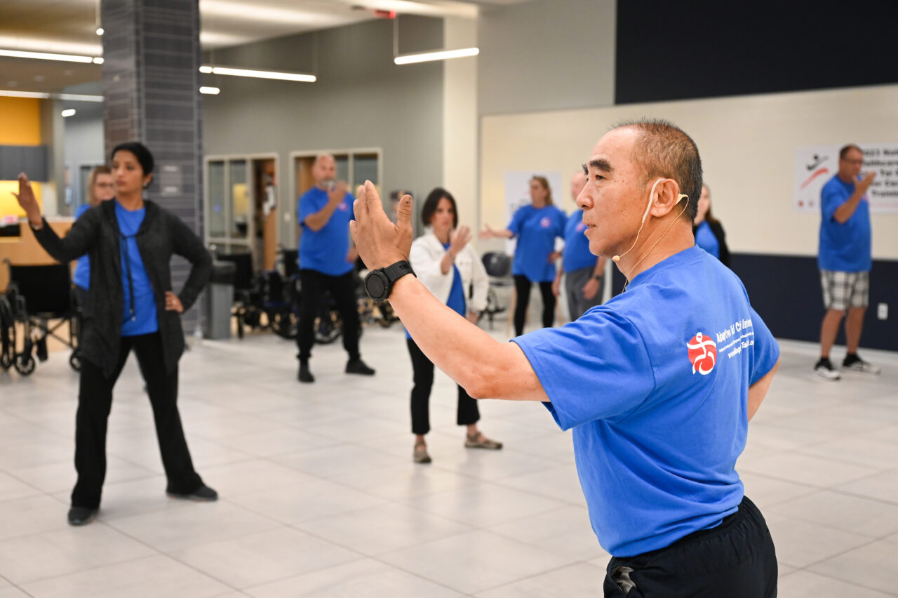 Zibin Guo and others participate in three-day Wheelchair Tai Chi for Veterans seminar Thursday, June 8, 2023 in Lupton Hall.