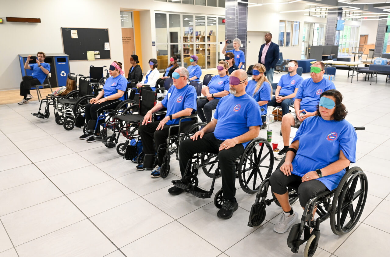 Zibin Guo and others participate in three-day Wheelchair Tai Chi for Veterans seminar Thursday, June 8, 2023 in Lupton Hall.