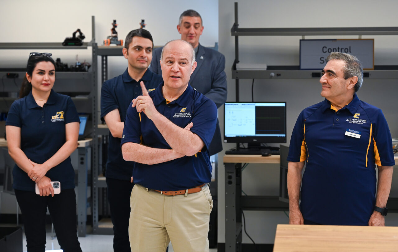 Dr. Ahad Nasab, center, speaks at the grand opening of the Robotics, Intelligent Systems and Control Lab on Thursday, May 4. Photo by Angela Foster.