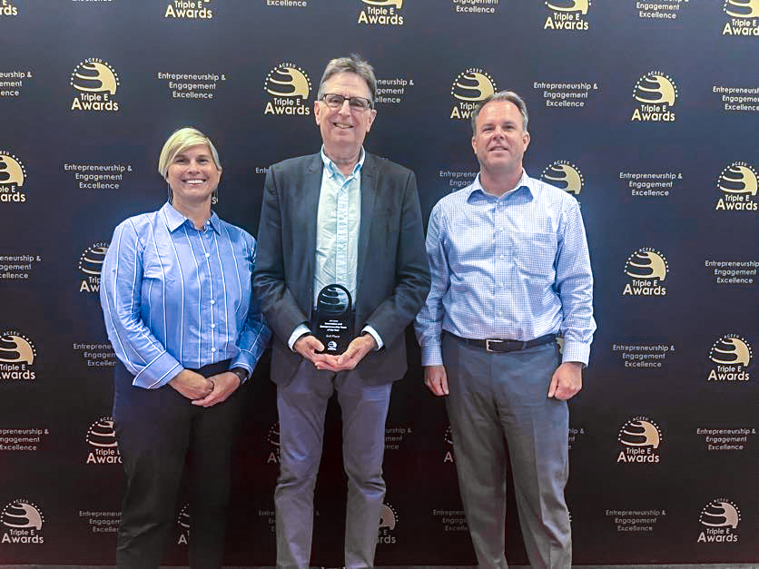 From left: UTC Commercialization Counselor Jennifer Skjellum, Dr. Thomas Lyons, Clarence E. Harris Chair of Excellence in Entrepreneurship and professor of marketing and entrepreneurship, and Gary W. Rollins College of Business Associate Dean Michael Jones.