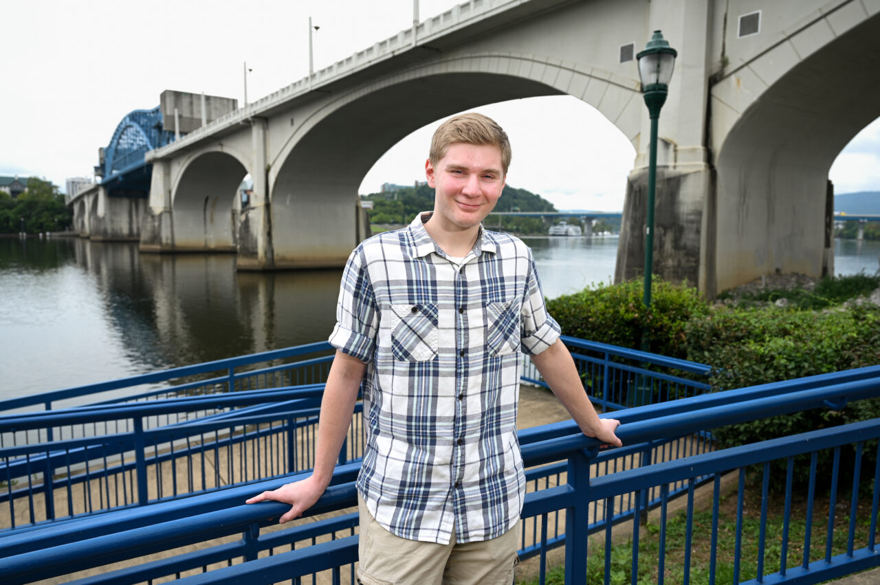 UTC senior Carter Jordan, pursuing a bachelor’s degree in environmental science with a concentration in biodiversity, conservation and natural resources, stands Friday, Aug. 4, near the Tennessee River at Coolidge Park. Photo by Angela Foster.