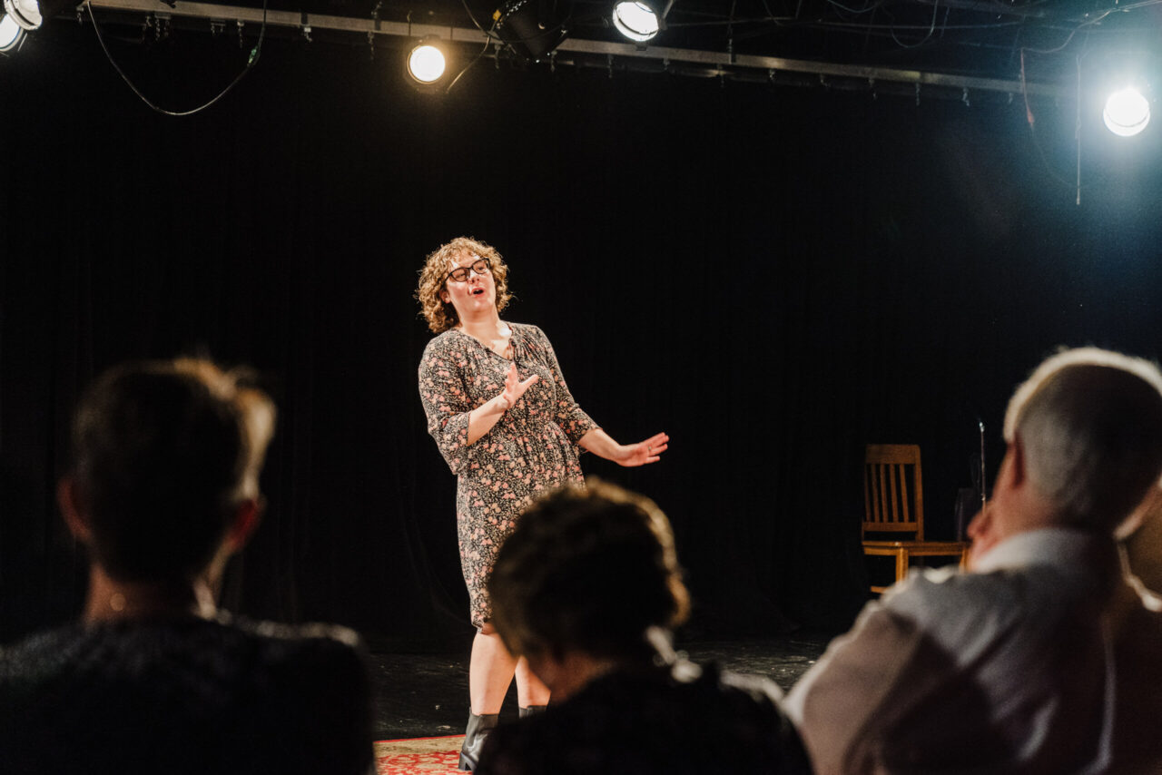 UTC senior theatre major Ellen Rich performs Pat Wilcox’s monologue during "Unmasking: Elders Speak." Photo by Brooke Bragger.