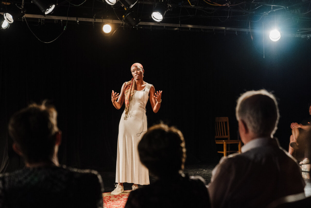 Brianna Jones performs Dr. Everlena Holmes' monologue during "Unmasking: Elders Speak." Jones, who earned bachelor's degrees in theatre and political science from UTC in 2019, now serves as programs and grants coordinator for ArtsBuild. Photo by Brooke Bragger.