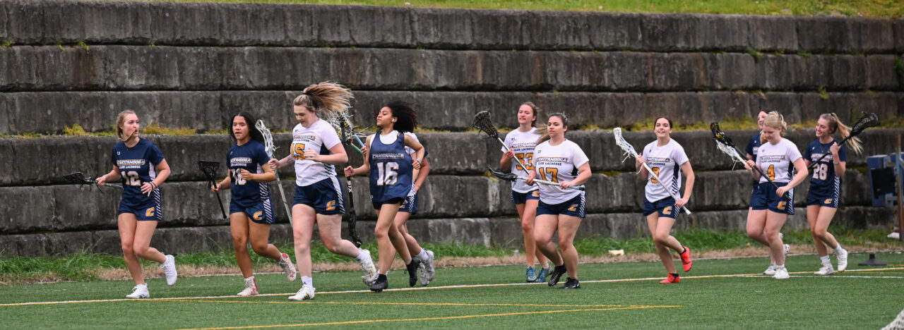 UTC women's lacrosse players warm up for an April 2023 match. Photo by Angela Foster.