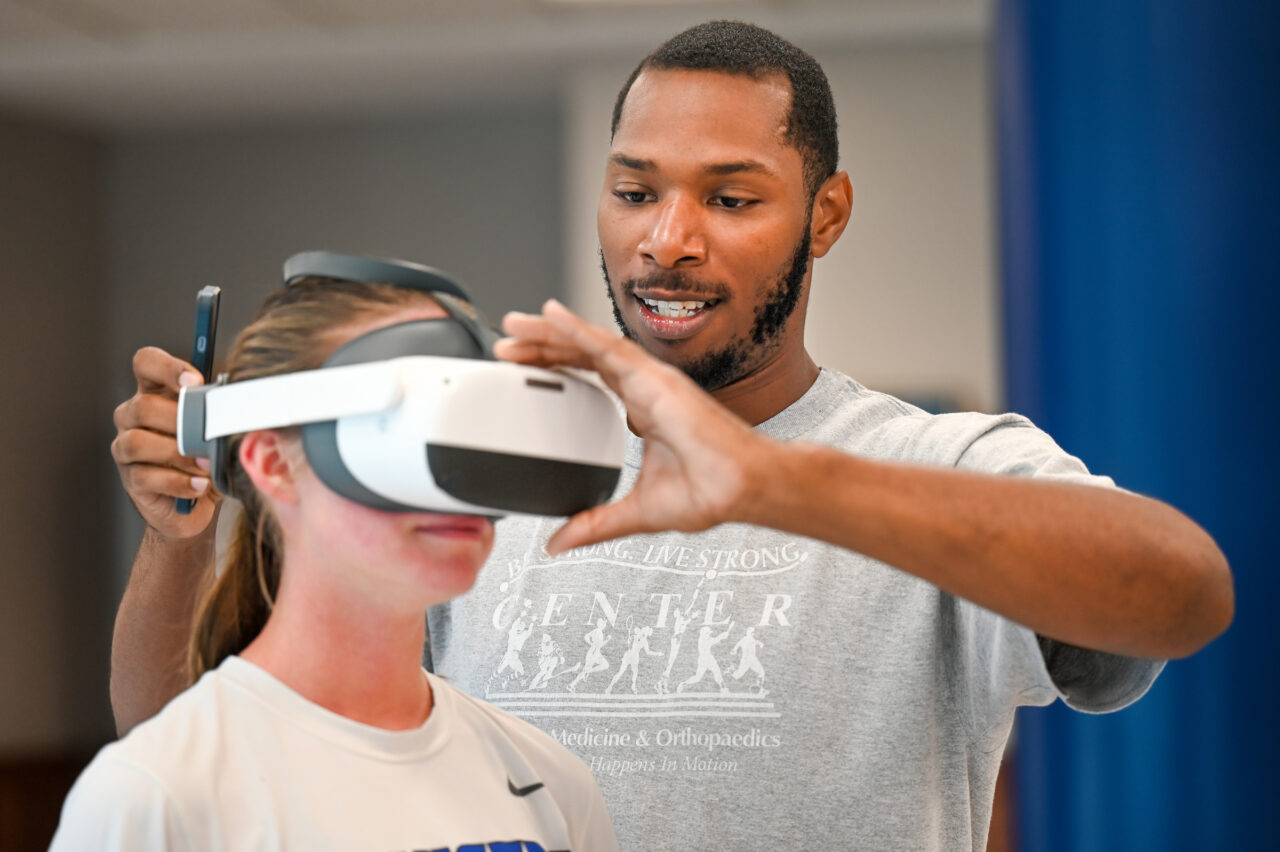 Girls Preparatory School Athletic Trainer Michael Loving , a two-time UTC alum, uses VR training while working with GPS soccer players. Photo by Angela Foster.