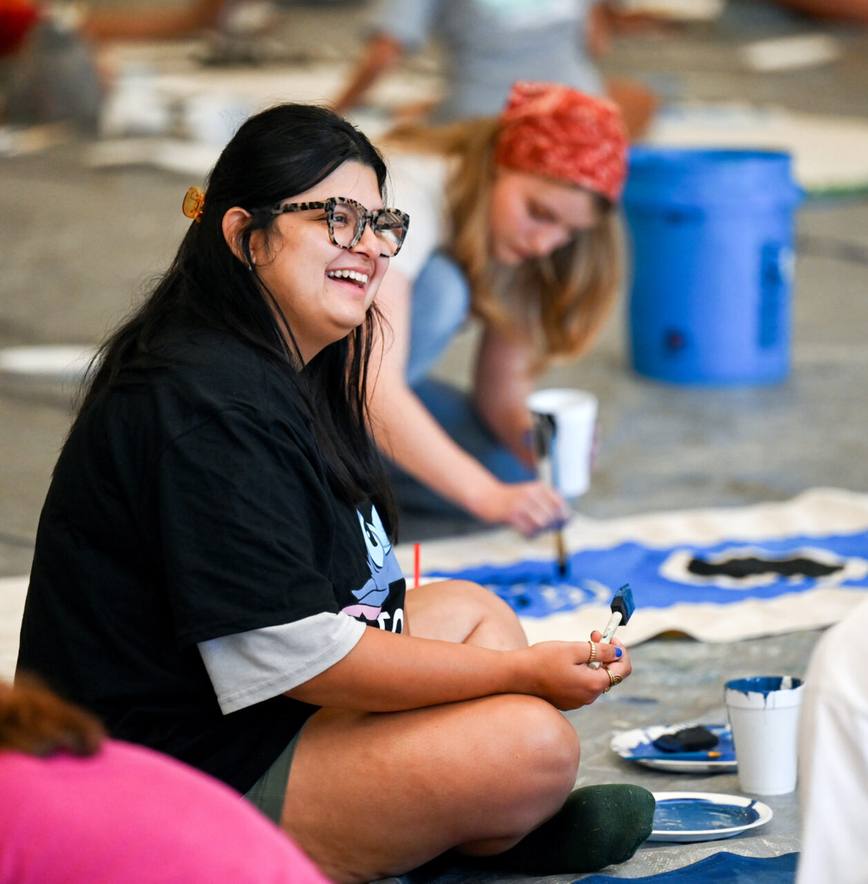 Students paint Homecoming banners Sunday, Oct. 1, 2023 in the University Center.