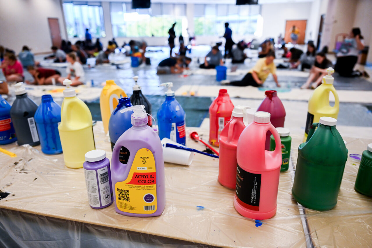 Students paint Homecoming banners Sunday, Oct. 1, 2023 in the University Center.