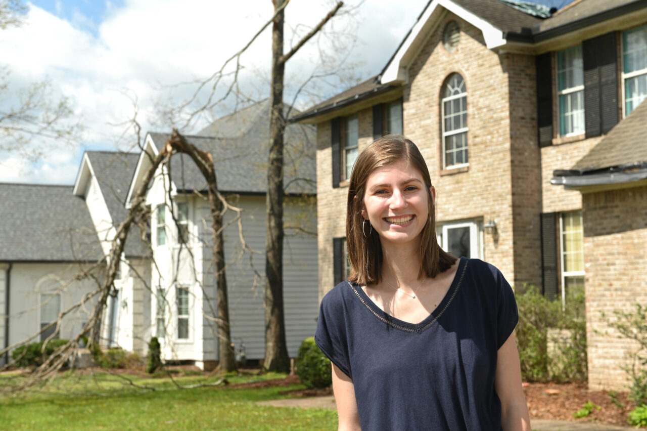 Briana Brady stands near her East Brainerd home Wednesday, May 6, 2020. Her family's home was destroyed in the April 11 tornado that damaged hundreds of homes in the Chattanooga area.