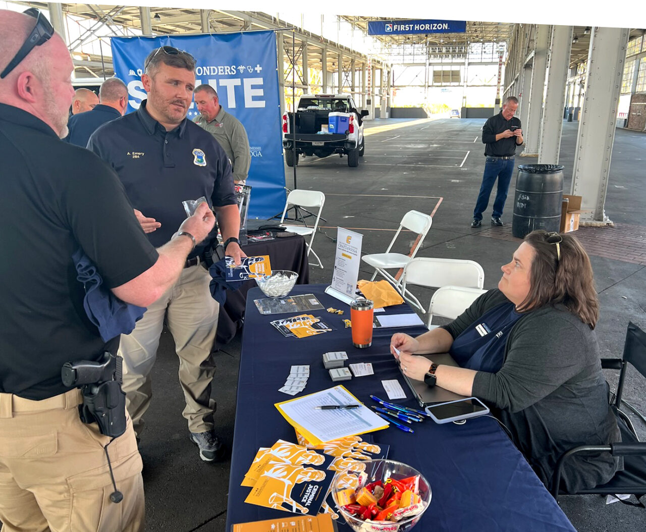 Lt. Adam Emery, a UTC alum who oversees the homicide division at the Chattanooga Police Department, chats with UTC Criminal Justice Professor Sherah Basham about the University's online bachelor's degree program at a recent first-responder appreciation event. Photo by Charlie Reed.