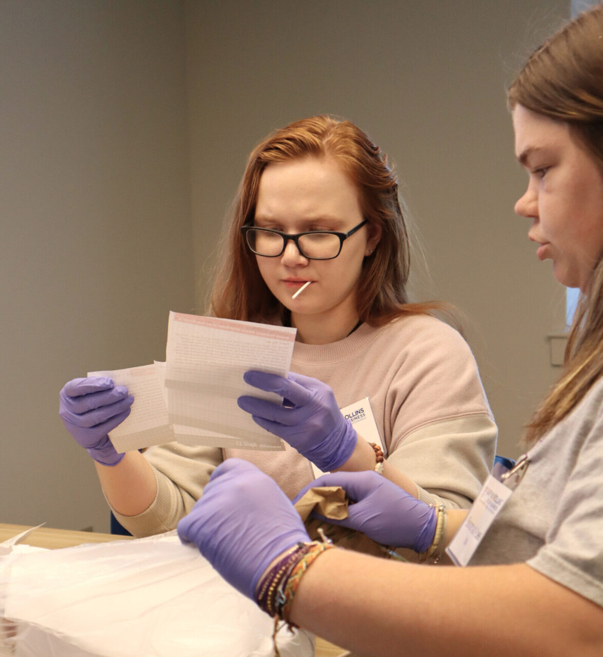 Students Bryce Didanato, left, and Savannah Ellis examine evidence as part of the forensic accounting seminar at UTC. Photo by Katrina Craven.