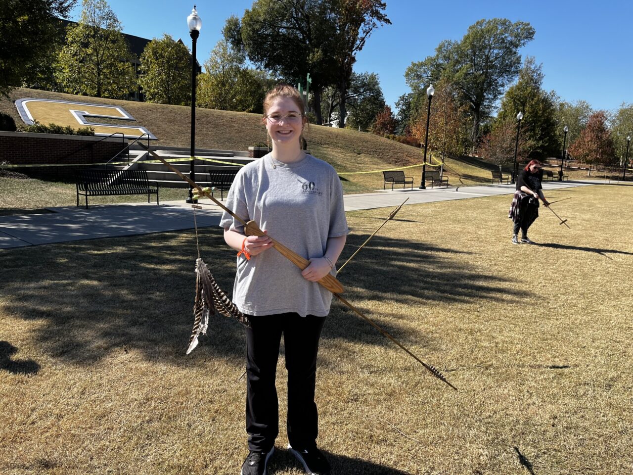 Anthropology major Rachel Watts won the Moche Badminton Toss, a game played within the prehistoric Moche culture of South America. The game is a type of target practice in which participants launch darts using atlatls at a feathered shuttlecock as it unravels from a thrown dart. In the five years of doing the Moche toss at the workshop, Watts was the first student to hit the target and win the Moche toss. Photo credit: Dr. Brooke Persons.