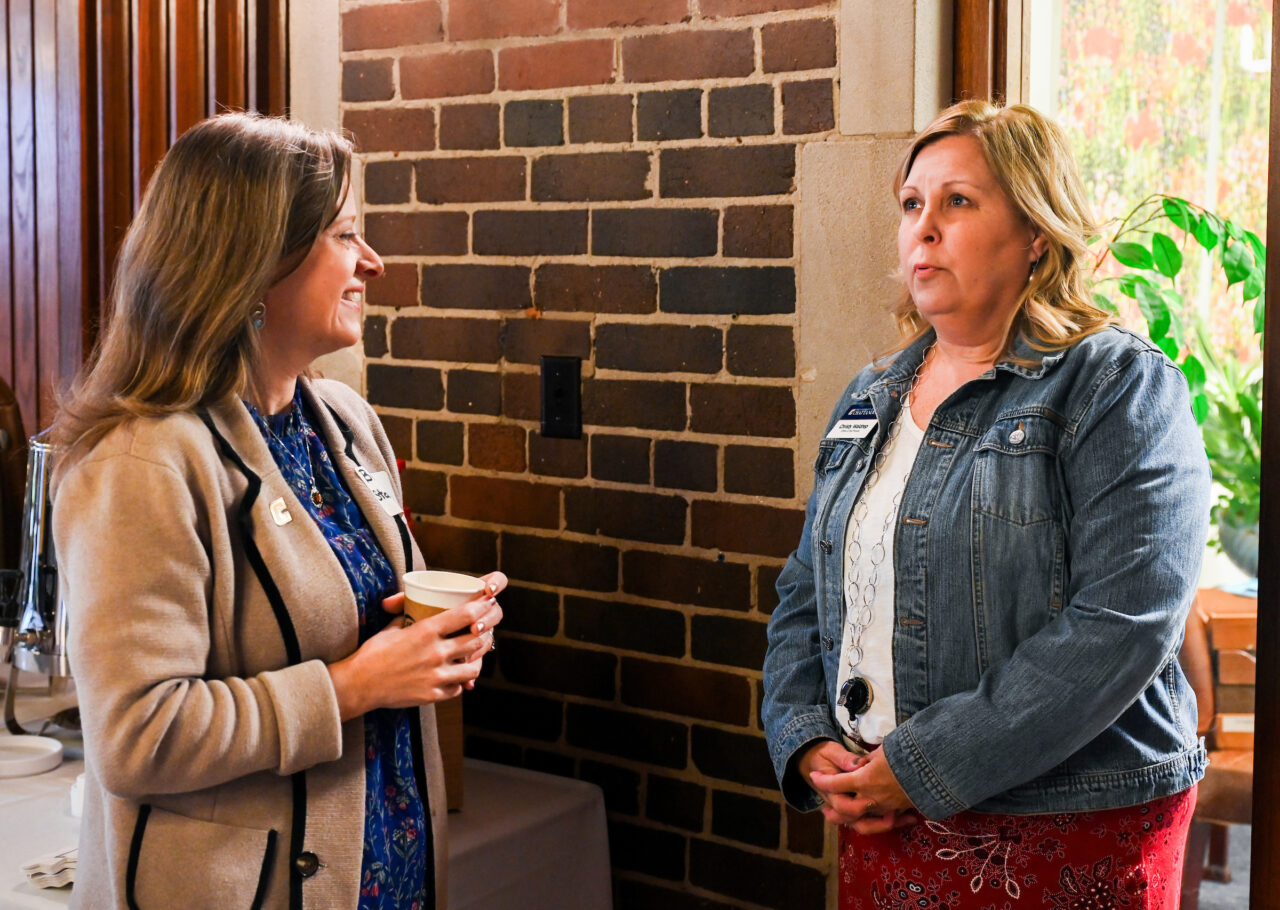 Brooke Stappenbeck, left, and Christy Waldrep speak at the Oct. 24 meet-and-greet event.
