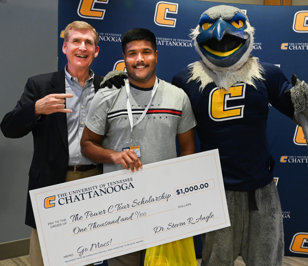 At the Power C Tour Chattanooga stop, high school senior Joel Thomas was one of three students presented a $1,000 Power C scholarship by Chancellor Steve Angle and Scrappy. Photo by Angela Foster.