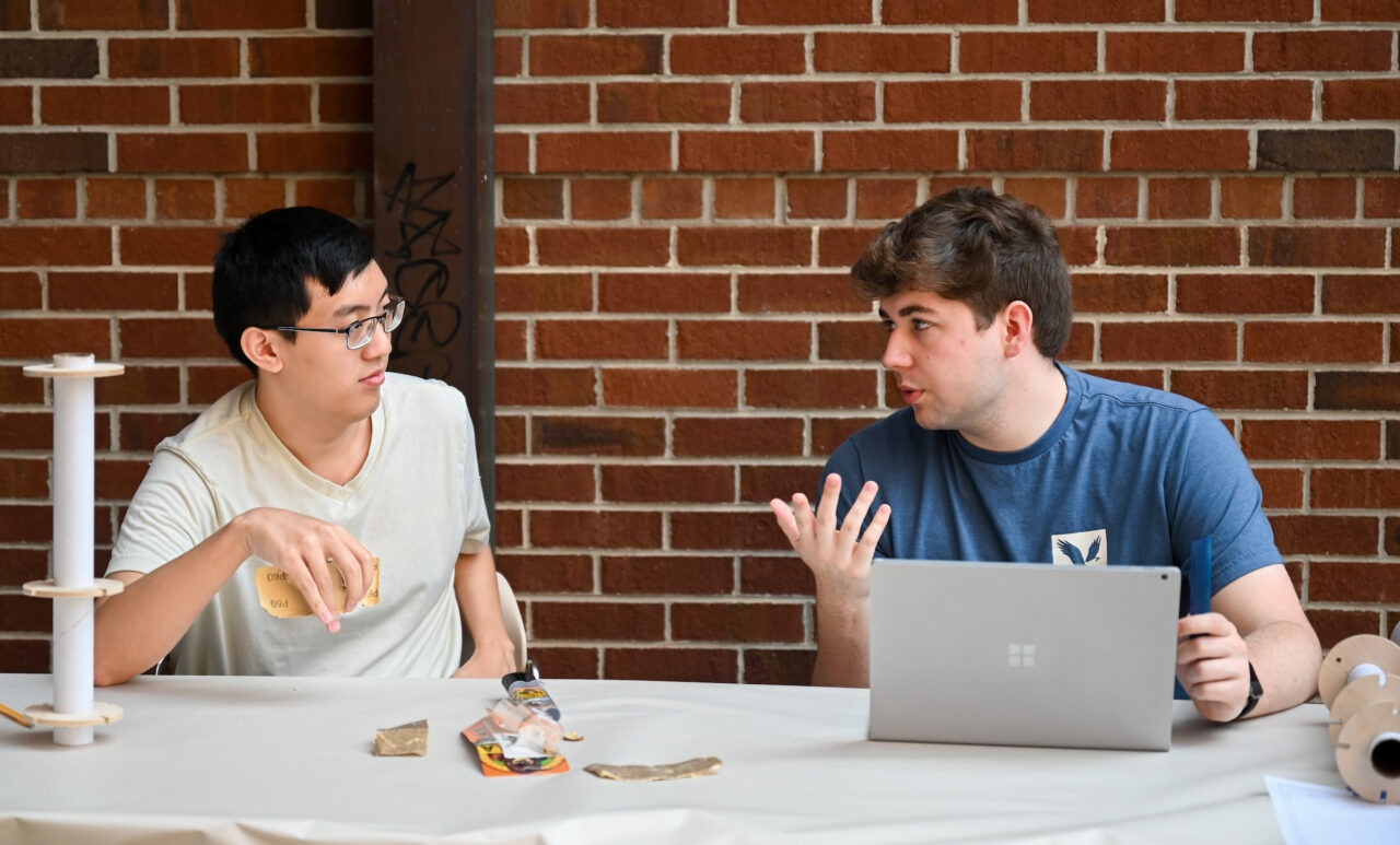 Rocket Mocs members Joshua Tang and Rett Stockman at the team's Oct. 27 meet-and-greet in the Engineering and Computer Science breezeway.