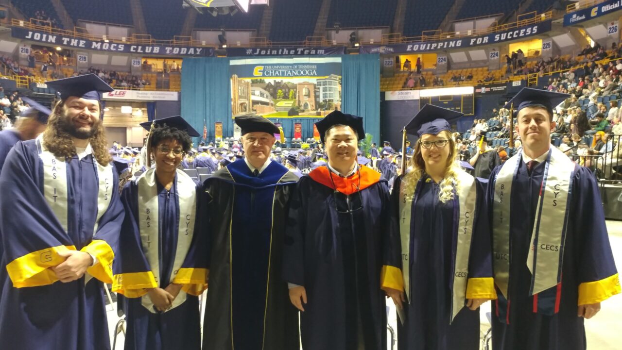 The first UTC BAS-IT CyS cohort at December 2023 commencement ceremonies. From left: Jaeden Adami, Mischka Scott, College of Engineering and Computer Science Interim Dean Ahad Nasab, Dr. Chang Phuong, Amber Gordy and Noah Syler.