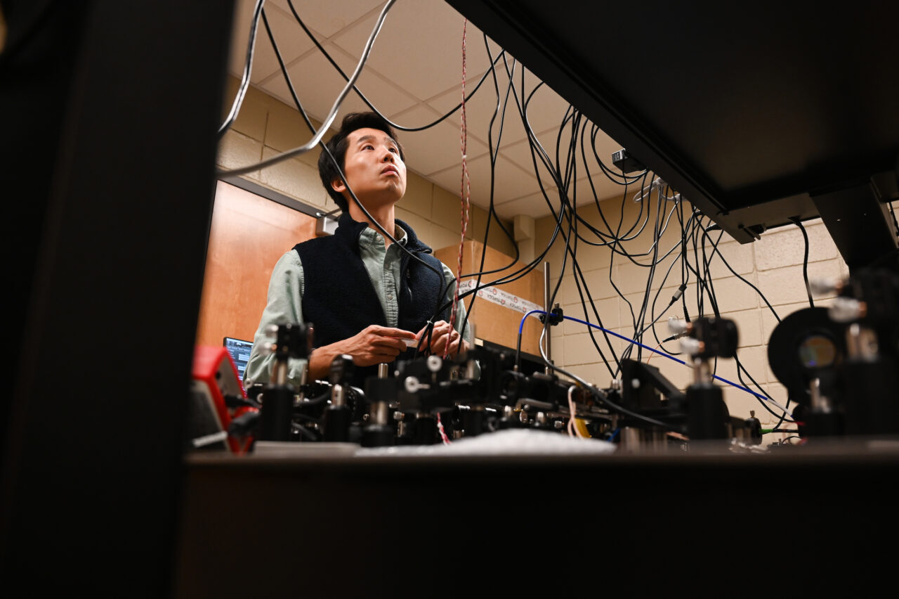 Assistant Professor of Physics Tian Li works in the UTC Quantum Physics lab (photo credit: Angela Foster).