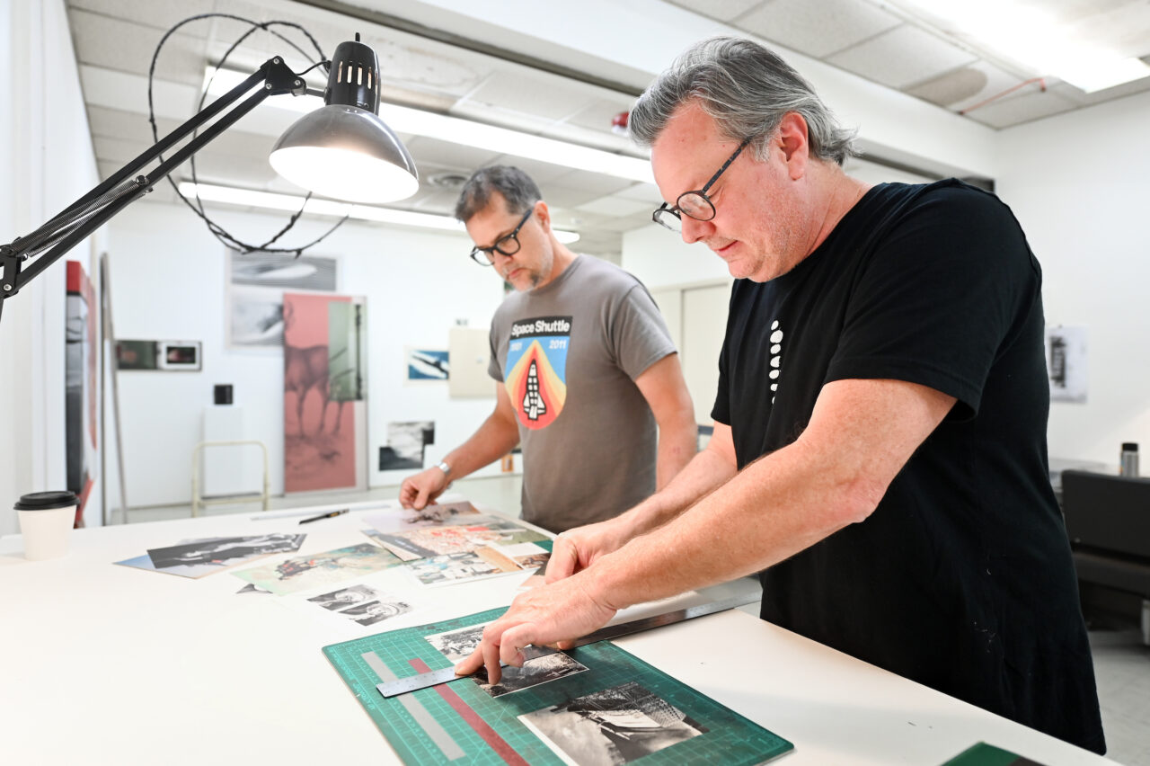 Matt Greenwell, left, and Ron Buffington work on art in their studio space on McCallie Avenue. Photo by Angela Foster.