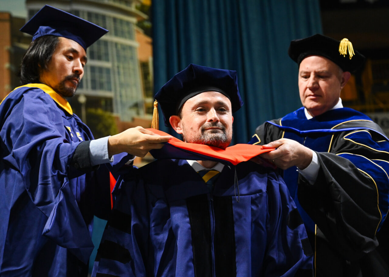 Students participate in the Graduate School commencement Friday, Dec. 15, 2023 in McKenzie Arena.