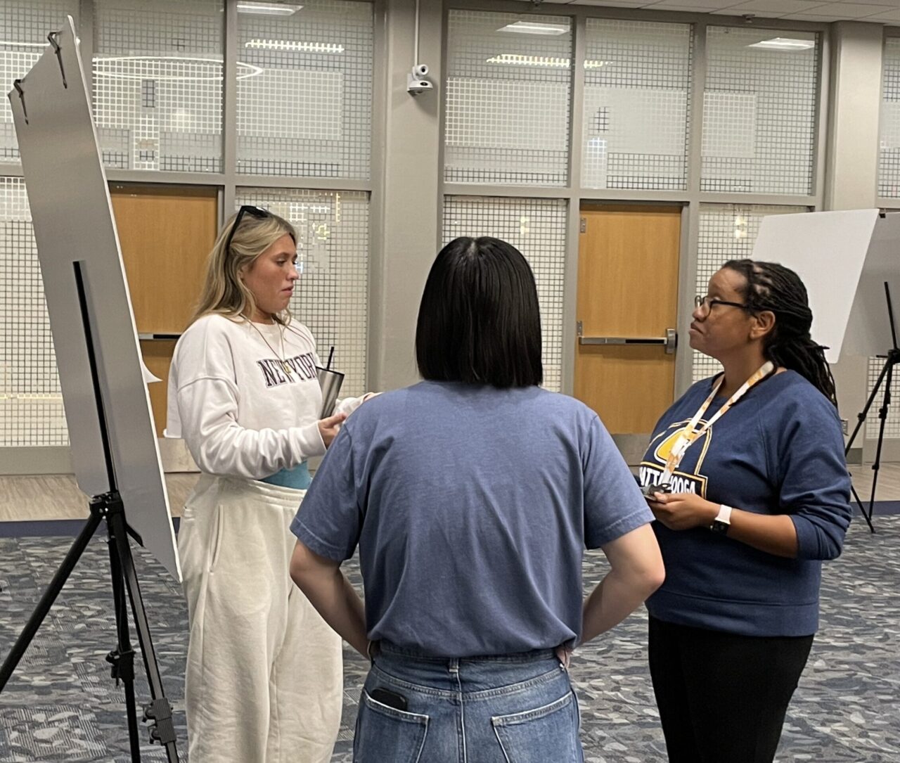 UC Foundation Assistant Professor DeAnna Beasley listens as Barbie Edwards explains a research project on ant ecology.