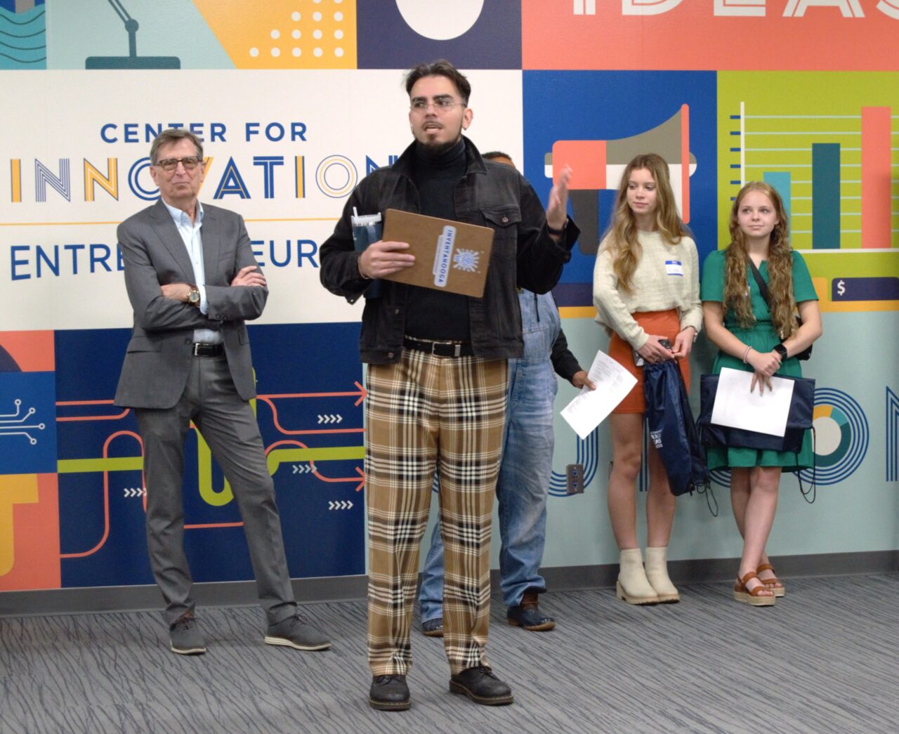Kyle Carrasco, center, program director of Inventanooga and a teacher at STEM School Chattanooga, at a morning discussion in the UTC Center for Innovation and Entrepreneurship.