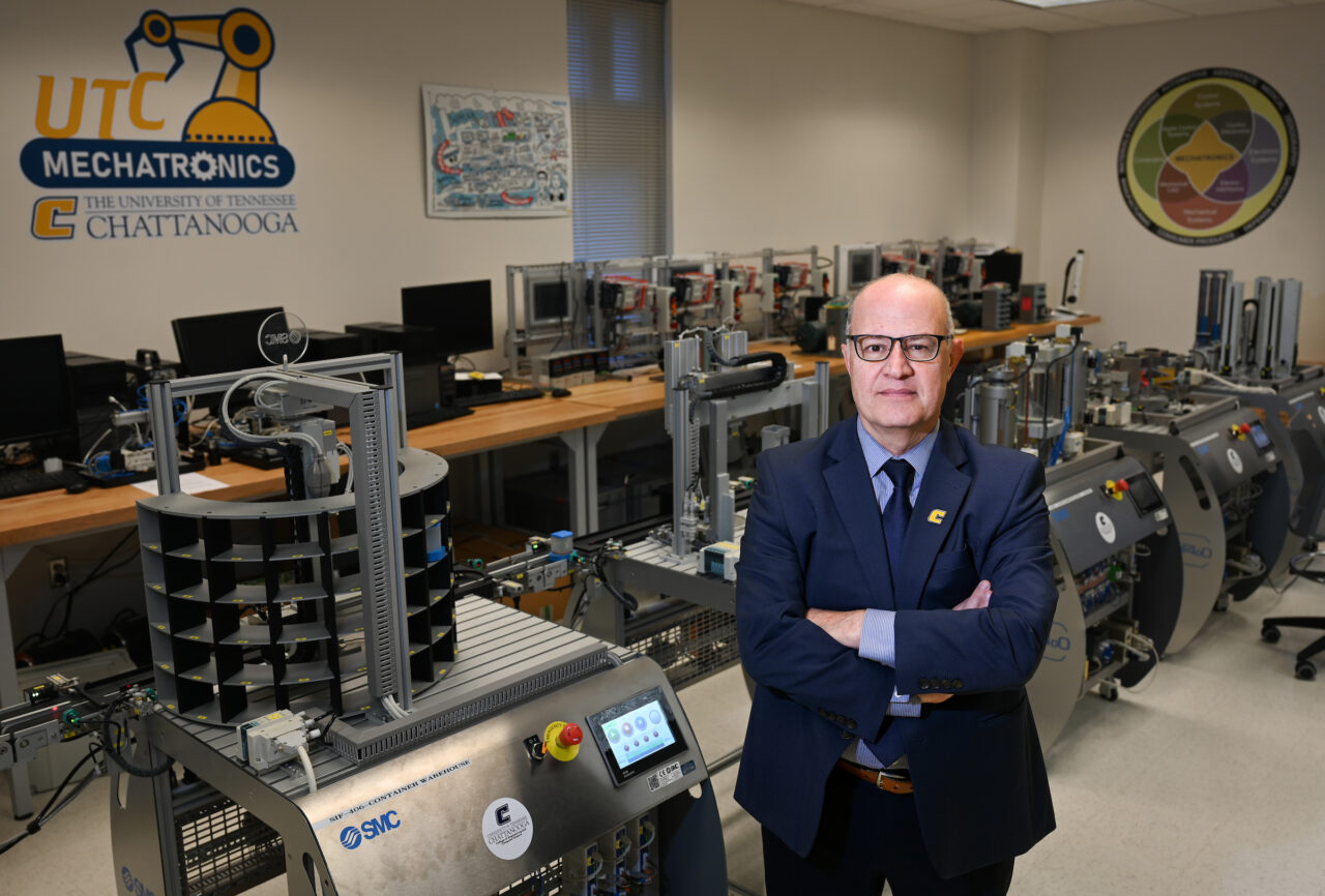 Dr. Ahad Nasab, standing in the College of Engineering and Computer Science's mechatronics lab, has been a member of the UTC faculty since 2018. Photo by Angela Foster.