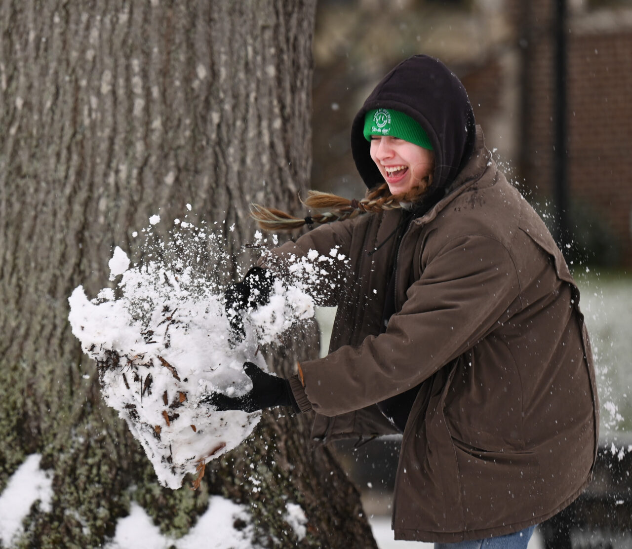 Students play in the snow Monday, Jan. 15, 2024 on Chamberlain Field.