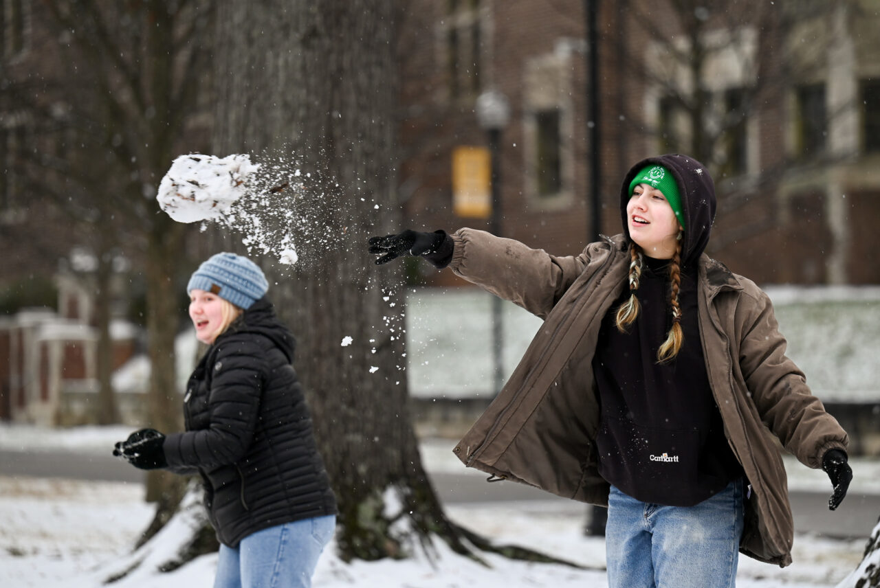 Students play in the snow Monday, Jan. 15, 2024 on Chamberlain Field.