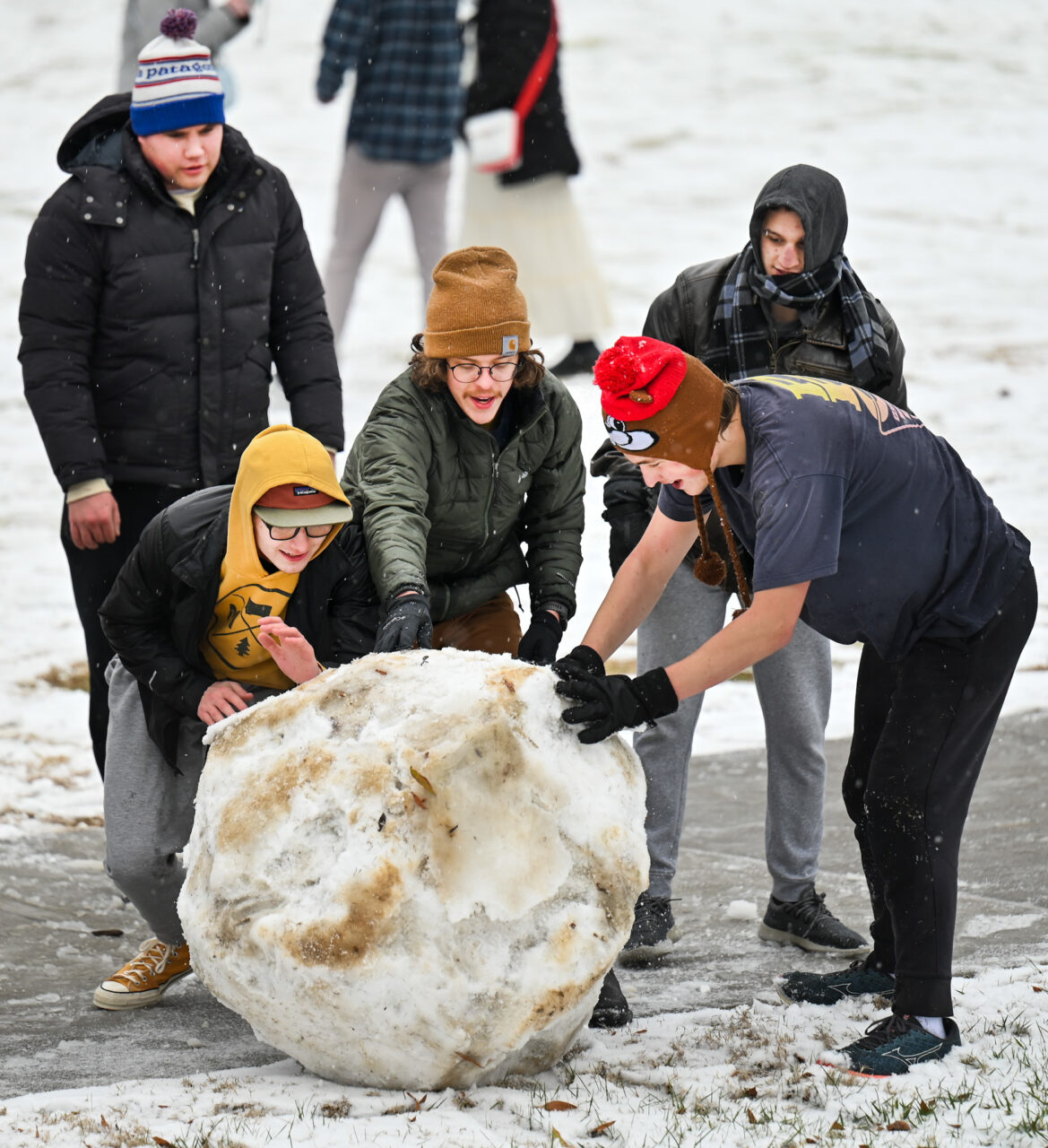 Students play in the snow Monday, Jan. 15, 2024 on Chamberlain Field.