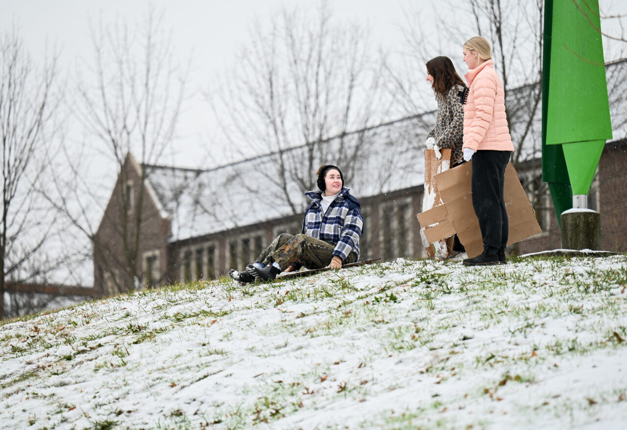 Students play in the snow Monday, Jan. 15, 2024 on Chamberlain Field.