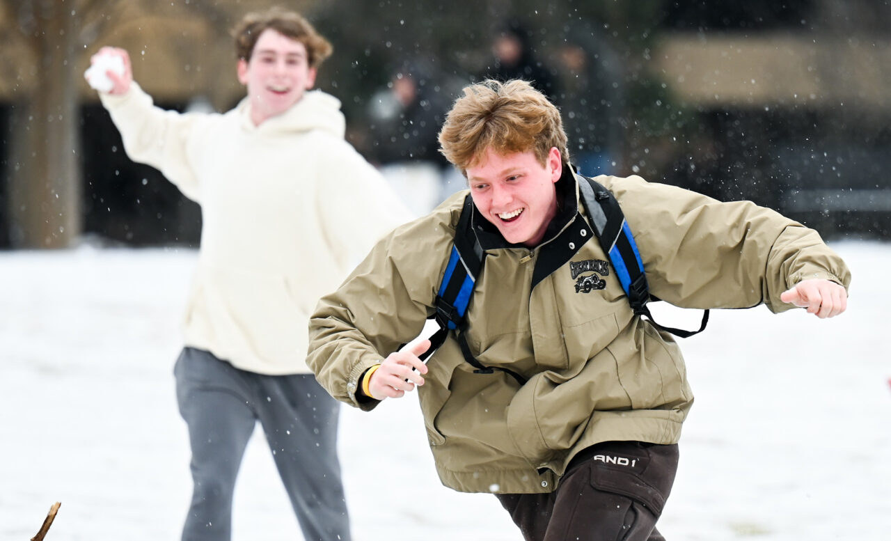Students play in the snow Monday, Jan. 15, 2024 on Chamberlain Field.