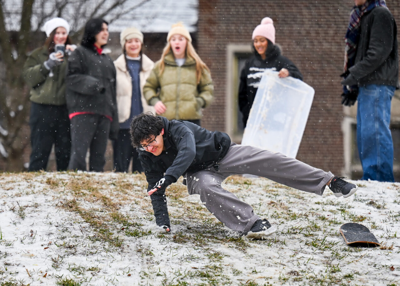 Students play in the snow Monday, Jan. 15, 2024 on Chamberlain Field.