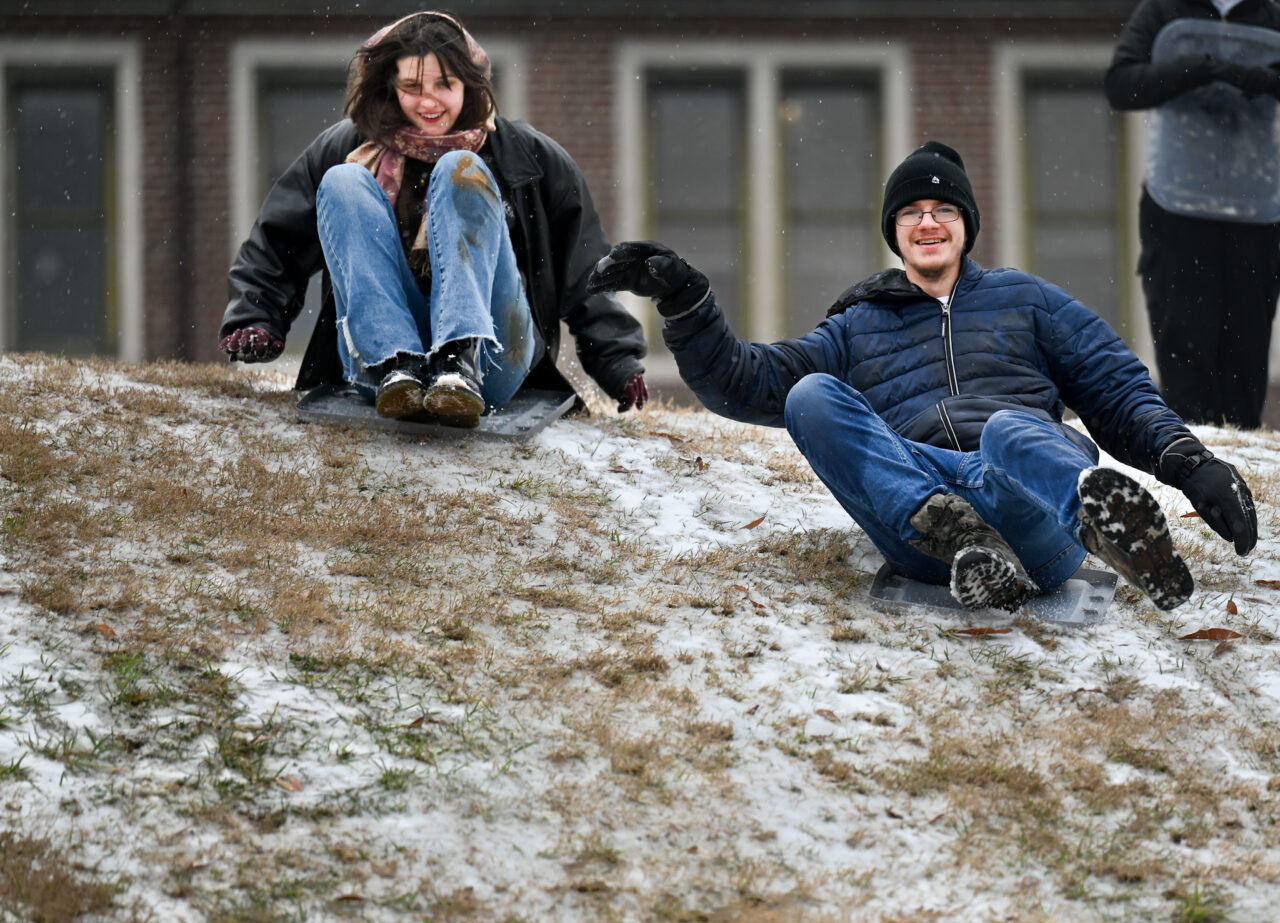 Students play in the snow Monday, Jan. 15, 2024 on Chamberlain Field.