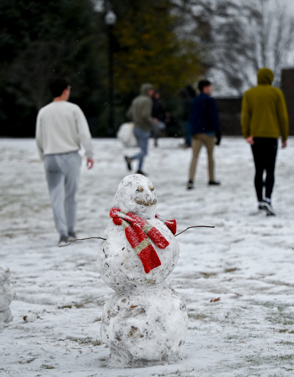 Students play in the snow Monday, Jan. 15, 2024 on Chamberlain Field.
