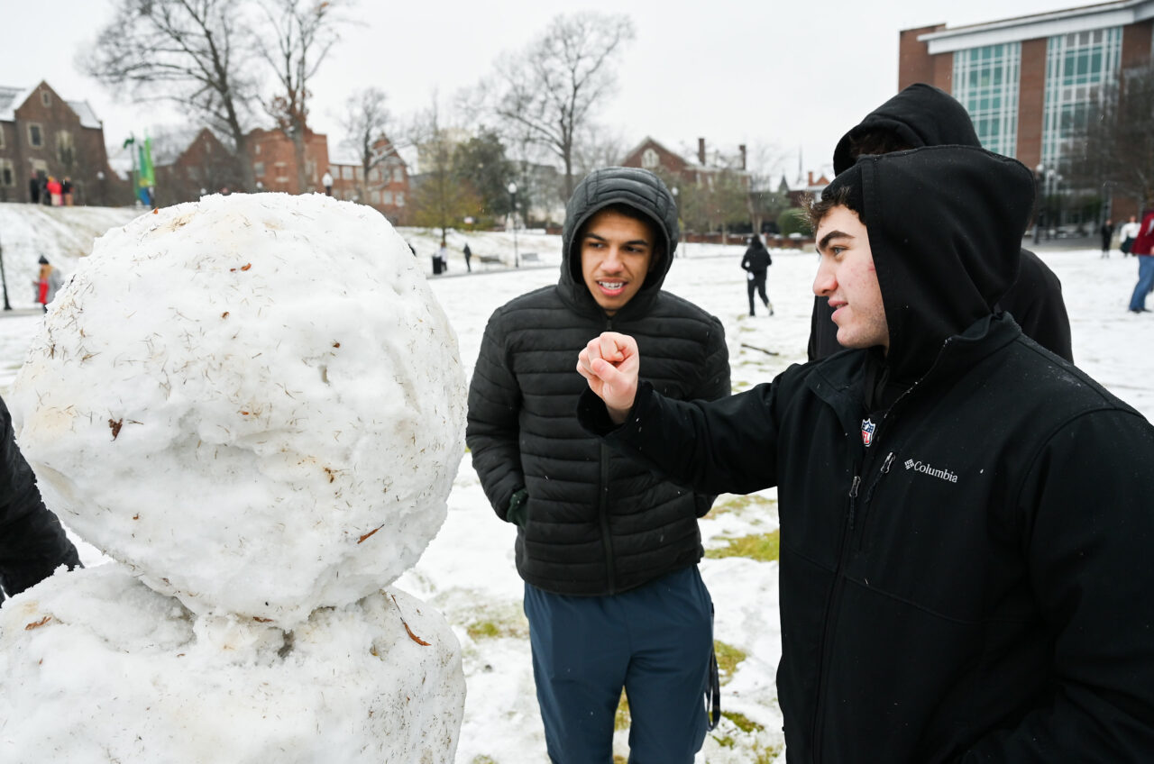 Students play in the snow Monday, Jan. 15, 2024 on Chamberlain Field.