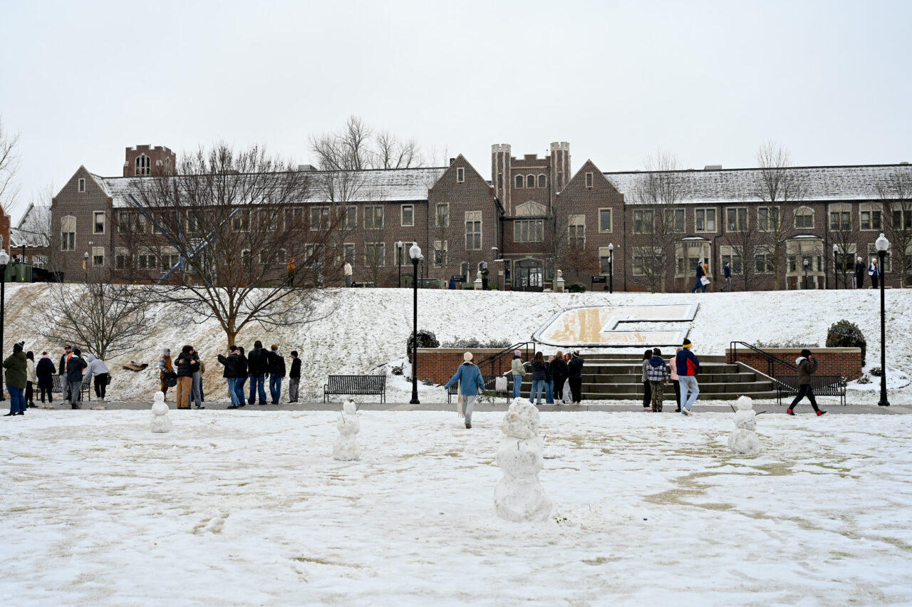 Students play in the snow Monday, Jan. 15, 2024 on Chamberlain Field.