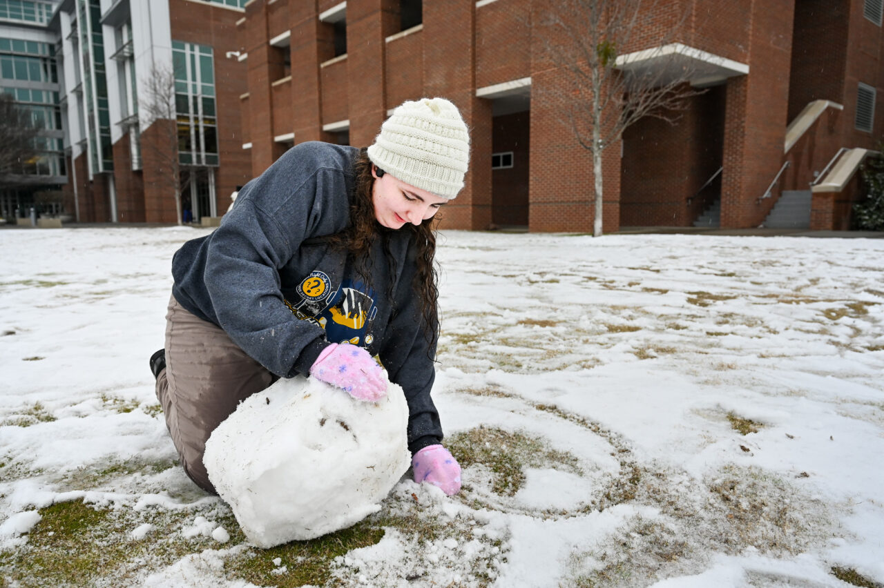 Students play in the snow Monday, Jan. 15, 2024 on Chamberlain Field.