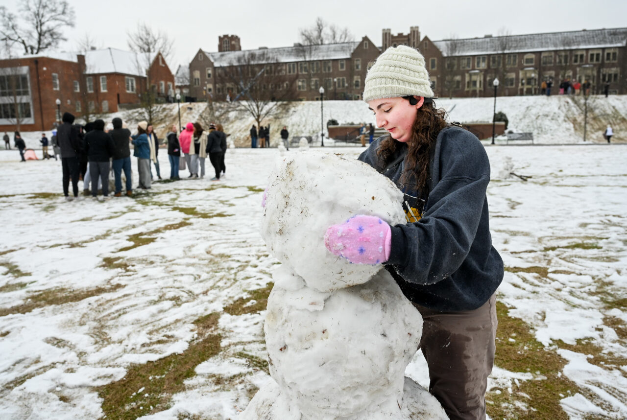 Students play in the snow Monday, Jan. 15, 2024 on Chamberlain Field.