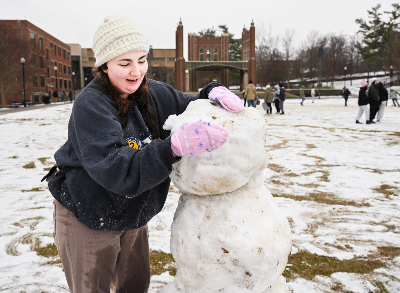 Students play in the snow Monday, Jan. 15, 2024 on Chamberlain Field.