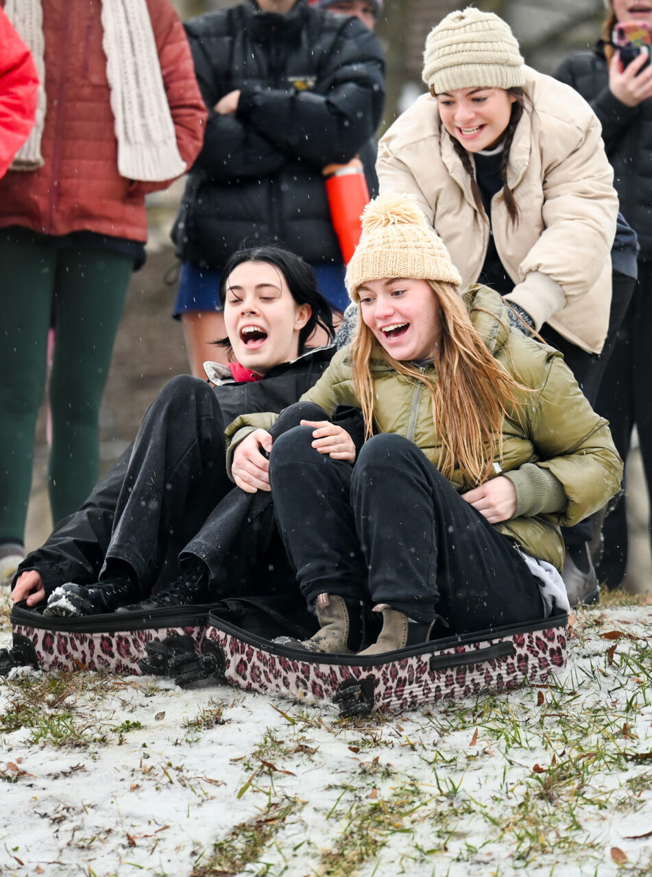 Students play in the snow Monday, Jan. 15, 2024 on Chamberlain Field.