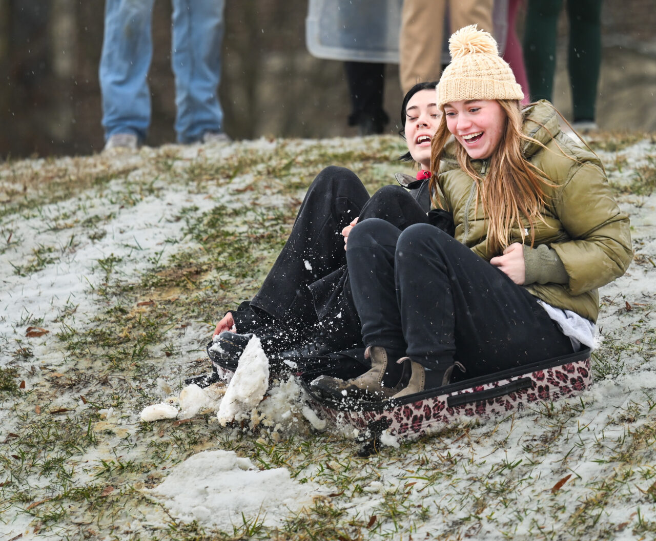 Students play in the snow Monday, Jan. 15, 2024 on Chamberlain Field.