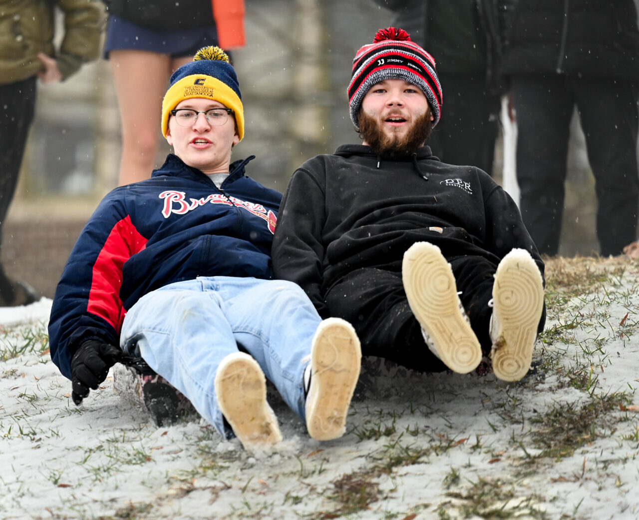 Students play in the snow Monday, Jan. 15, 2024 on Chamberlain Field.