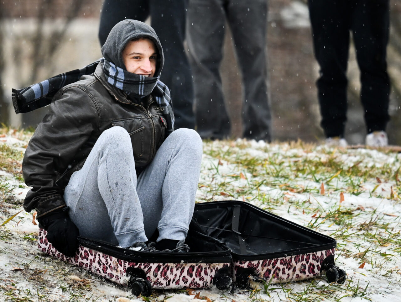 Students play in the snow Monday, Jan. 15, 2024 on Chamberlain Field.